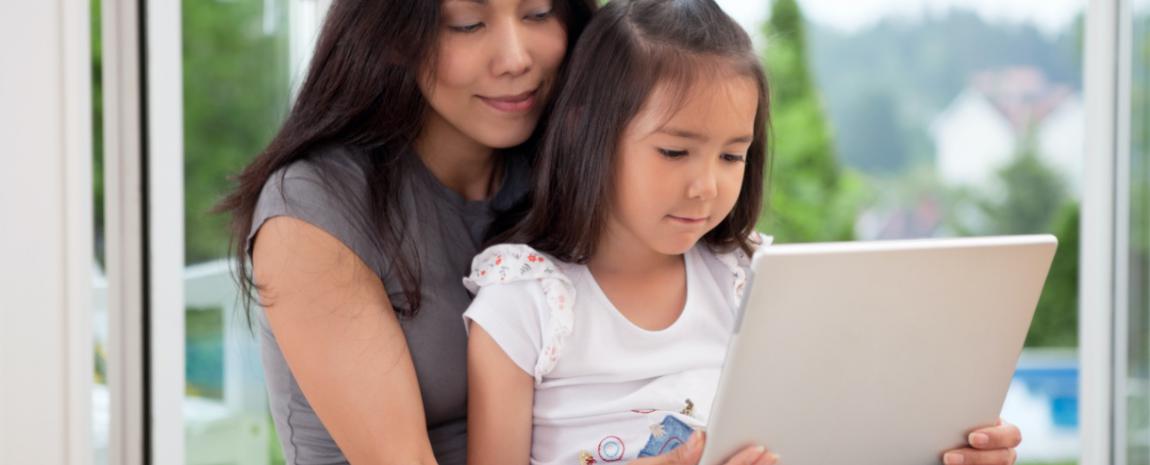 Mother and daughter using tablet