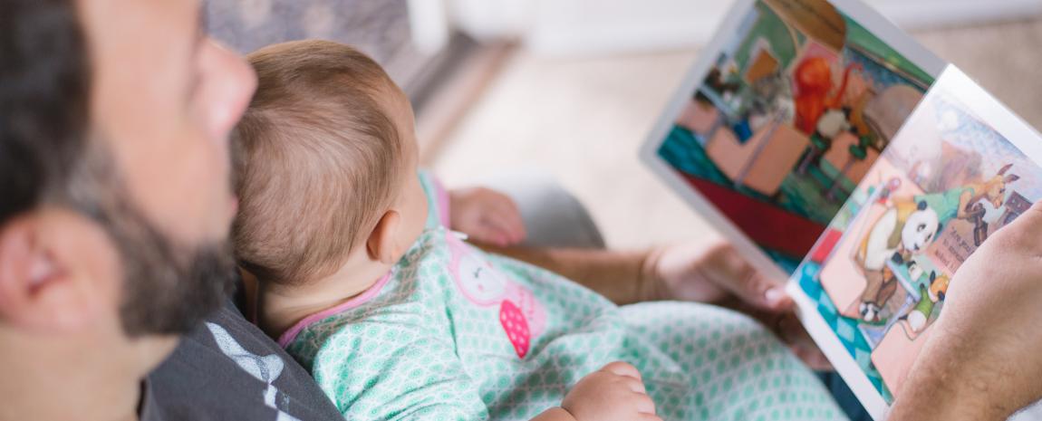 Father reading with baby