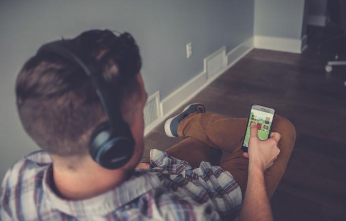 man with headphones, listening to device